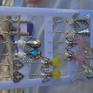 Seven Pairs Of Earrings Including Earring Rack. Crosses, Angels, Butterflies.